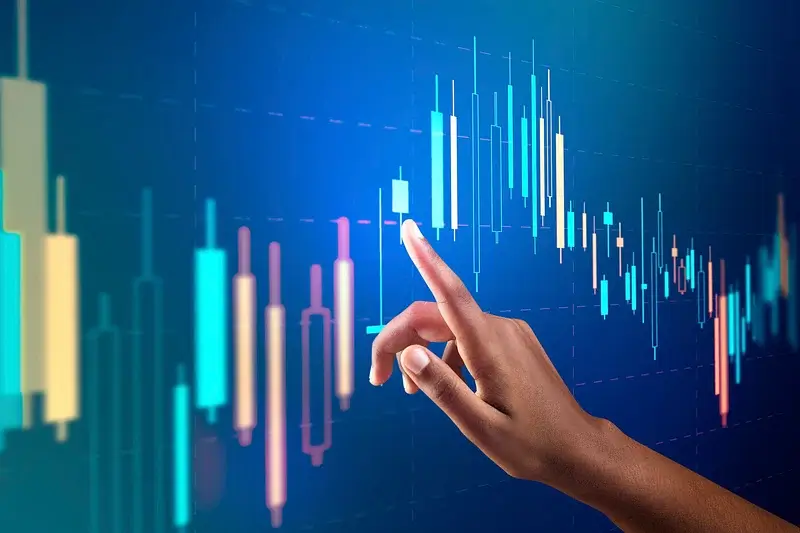 a hand pointing at a graph